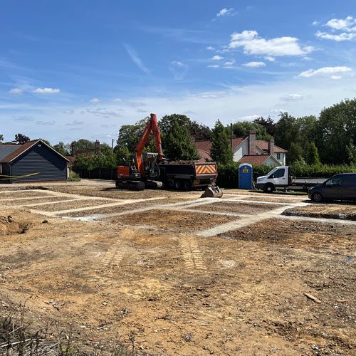 Groundworks contractor preparing foundations on a building site in Cockfield, Suffolk