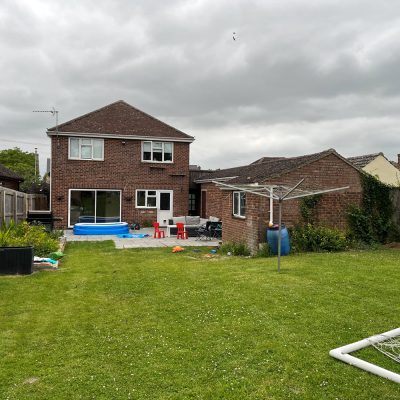 Existing garage before demolition for extension project in Burwell