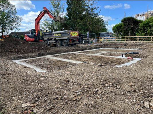 Concrete foundations being poured for residential groundworks in Denham