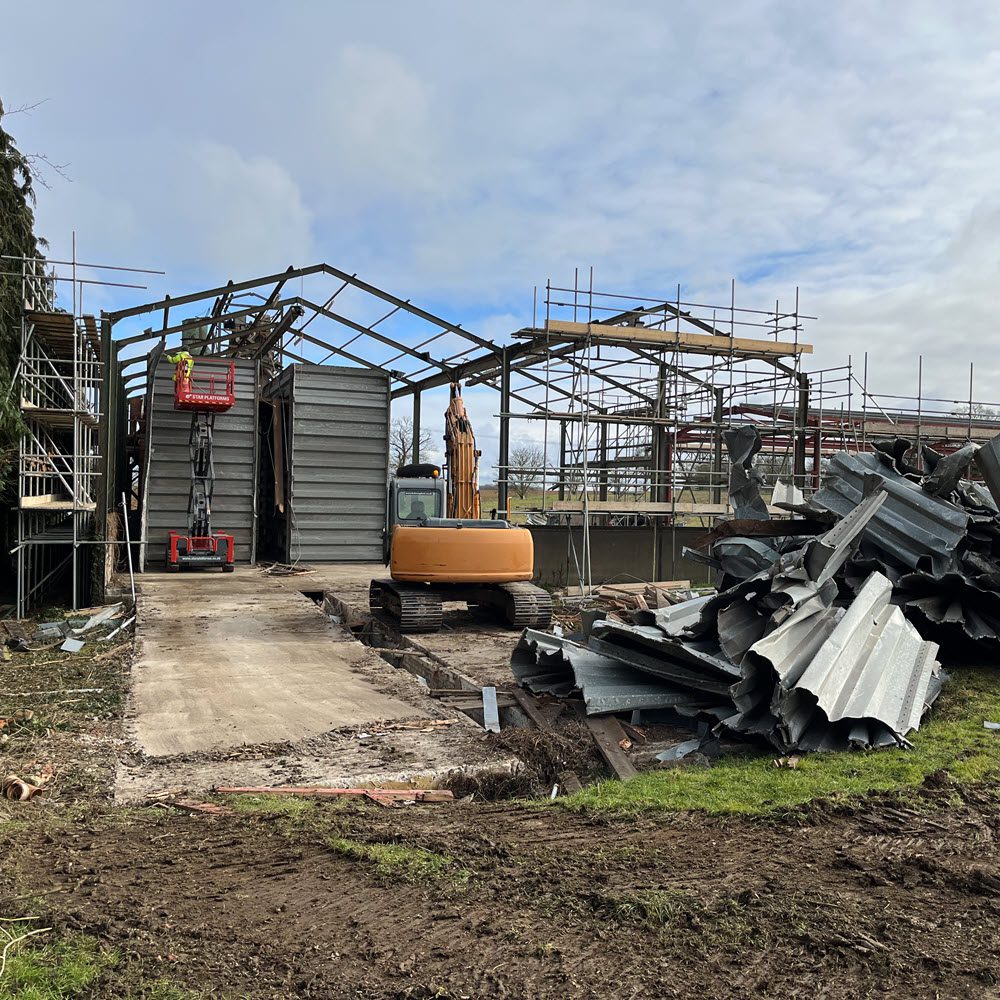 Dismantling grain bins on agricultural site in Risby