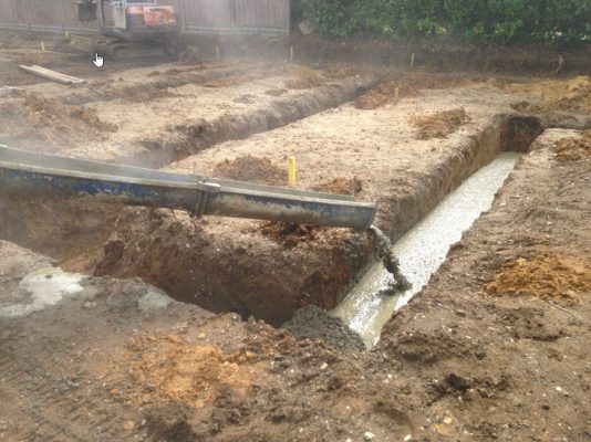 Risby - Concrete foundations being installed for new houses in Suffolk