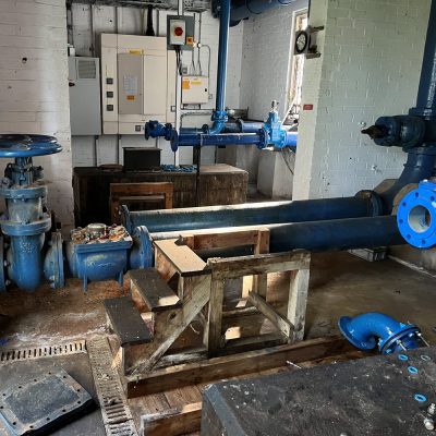 Water storage tanks and pipework before demolition in Keddington