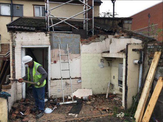 Hand work in demolition where required in listed building