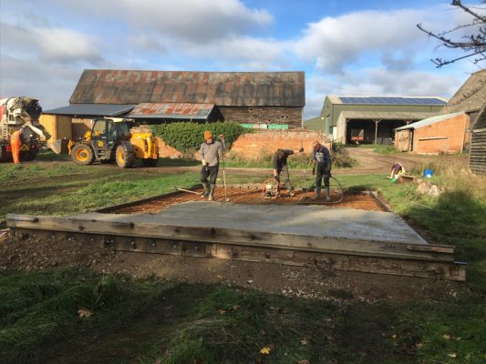Concrete base being poured for fertiliser tanks on farm site