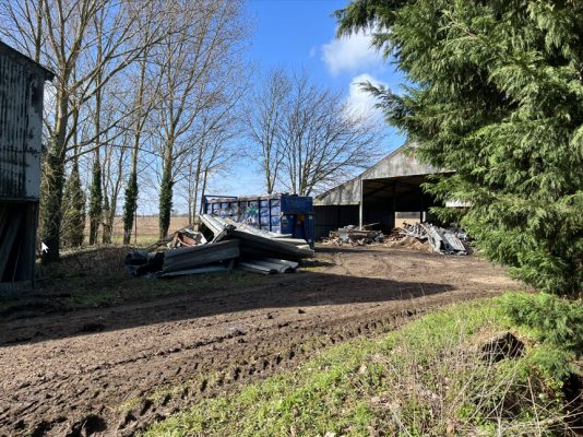 Dismantling grain bins and farm machinery in Stradishall