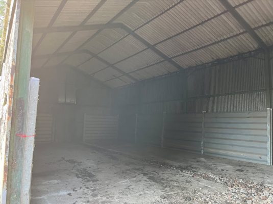 Cleared farm site after grain bin removal in Stradishall
